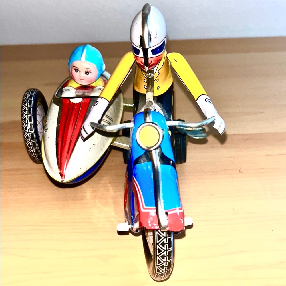 Vintage Schylling Motorcycle Racer windup tin toy with sidecar.